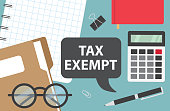 tax exempt written in speech bubble on office desk