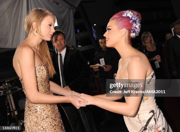 Taylor Swift and Katy Perry arrive at the 2011 American Music Awards at the Nokia Theatre L.A. LIVE on November 20, 2011 in Los Angeles, California.