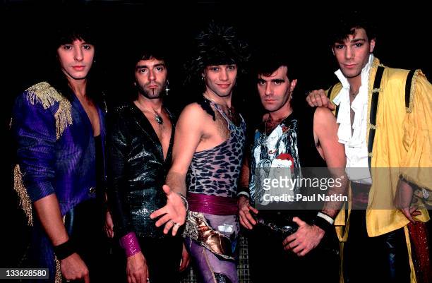 Portrait of American rock band Bon Jovi backstage before a performance at Summerfest, Milwaukee, Wisconsin, June 29, 1985. Pictured are, from...