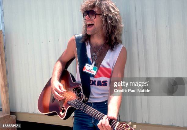 Portrait of American musician Jon Bon Jovi backstage at the Manor Downs Racetrack for the Farm Aid II Concert, Austin, Texas, July 4, 1986.