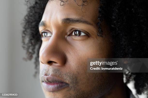 african-american man looking - effort face stock pictures, royalty-free photos & images