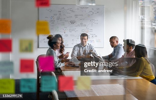 People in a business meeting planning their marketing strategy People in a business meeting planning their marketing strategy
