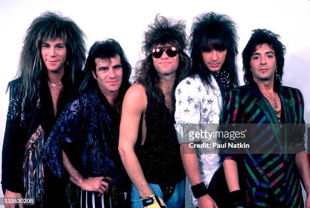 Portrait of American rock band Bon Jovi backstage before a performance, Illinois, early March, 1987. Pictured are, from left, David Bryan, Tico...