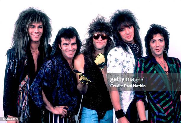 Portrait of American rock band Bon Jovi backstage before a performance, Illinois, early March, 1987. Pictured are, from left, David Bryan, Tico...