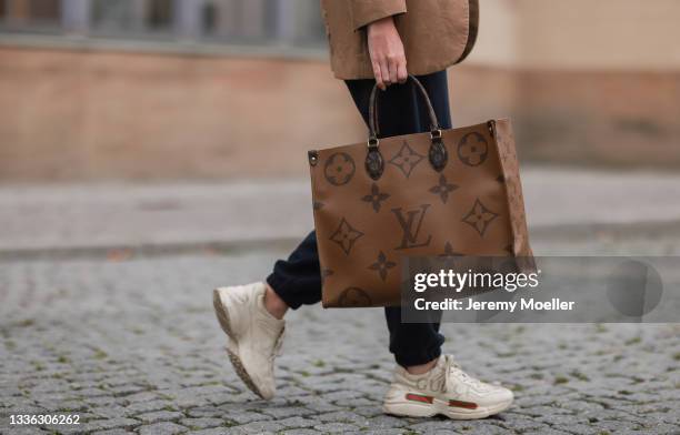 Trixi Giese wearing Cos navy blue jogging pants, Louis Vuitton bag, News  Photo - Getty Images