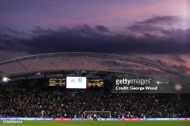 General view of play as the sun sets during the Carabao Cup Second Round match between Huddersfield Town and Everton at The John Smith's Stadium on...
