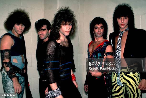 Portrait of American rock band Bon Jovi backstage before a performance at the Rosemont Horizon, Rosemont, Illinois, May 20, 1984. Pictured are, from...