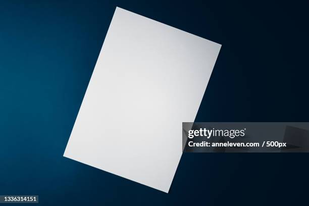 high angle view of blank paper against black background - newspaper mockup stock pictures, royalty-free photos & images