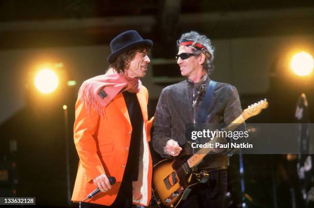 British musicians Mick Jagger and Keith Richards of the Rolling Stones perform on stage during the band's 'Bridges to Babylon' tour, late 1997 or...