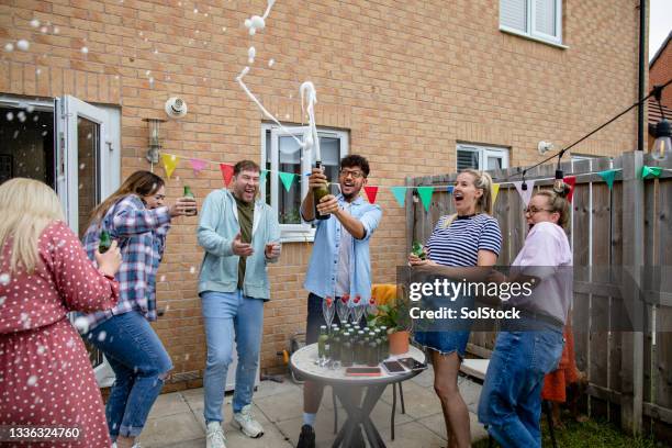 celebrating with prosecco - spraying champagne stock pictures, royalty-free photos & images