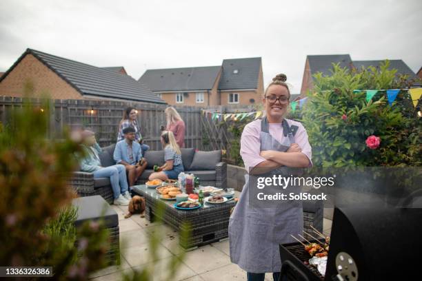 in charge of the bbq - british culture garden stock pictures, royalty-free photos & images