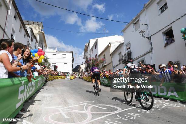 Ángel Madrazo Ruiz of Spain and Team Burgos - BH and Nicholas Schultz of Australia and Team BikeExchange passing through Valdepeñas de Jaén Village...