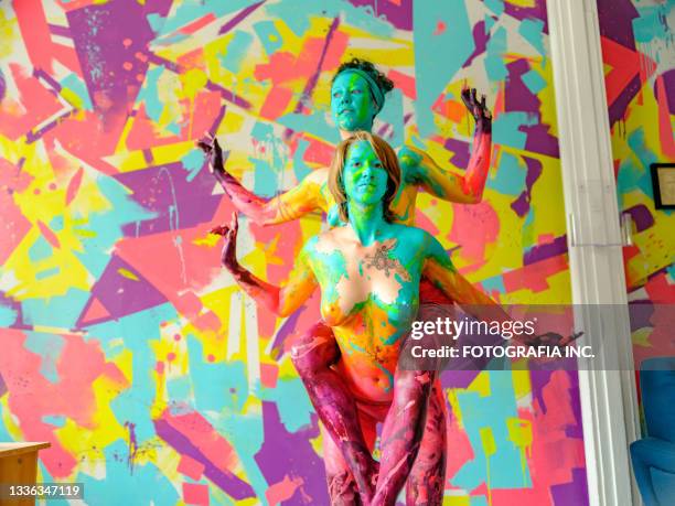 two women artists  during body painting session - body paint stock pictures, royalty-free photos & images