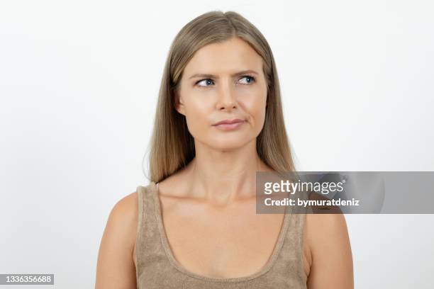 thoughtful woman looking - sorry funny stock pictures, royalty-free photos & images
