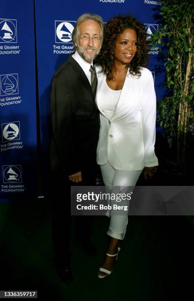 Grammy President Neil Portnow and American talk show host, television producer, actress, author, and philanthropist Oprah Winfrey arrive at the...