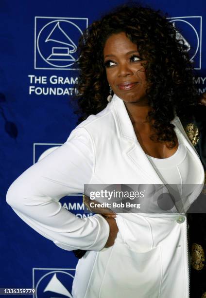 American talk show host, television producer, actress, author, and philanthropist Oprah Winfrey arrives at the GRAMMY Foundation's A Starry Night...
