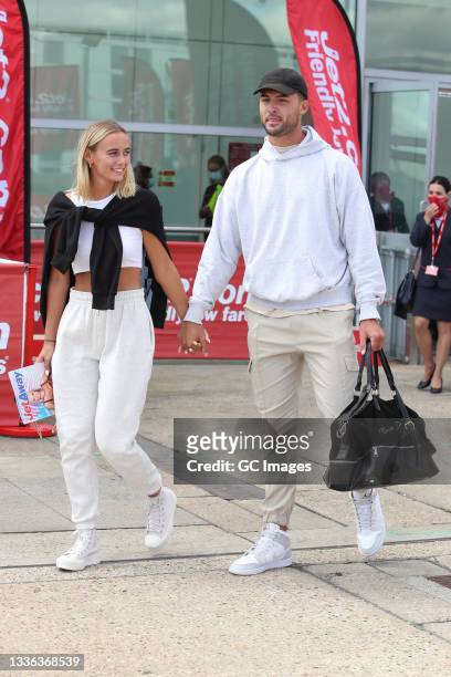 Millie Court and Liam Reardon seen arriving at London Stansted Airport after winning Love Island 2021 on August 25, 2021 in Stansted, Essex.