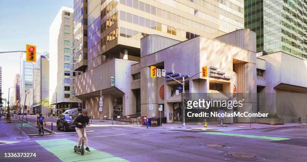 downtown ottawa city street intersection scene in front of public library on a sunny summer morning - ottawa downtown stock pictures, royalty-free photos & images