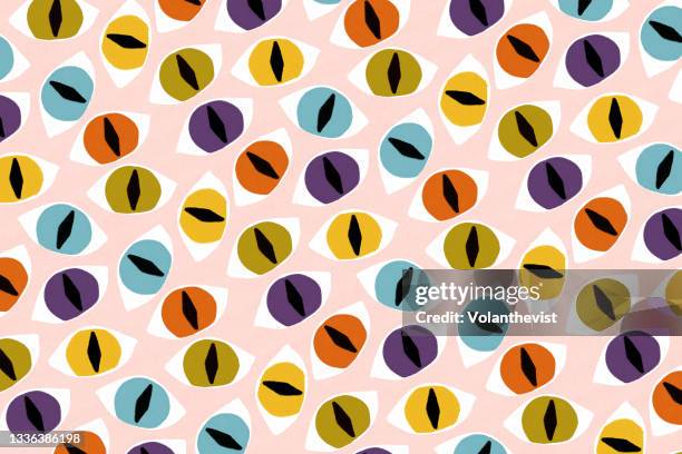 halloween scary cat eyes pattern on pink background - eye color stock pictures, royalty-free photos & images