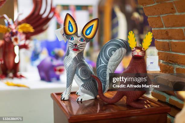 Handmade wooden carved figures of fantastic animals in the family workshop shop "El tallador de sueños", on August 14, 2021 in San Antonio Arrazola,...