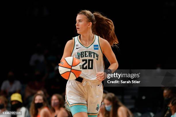 Sabrina Ionescu of the New York Liberty dribbles during the first half against the Phoenix Mercury at Barclays Center on August 25, 2021 in the...