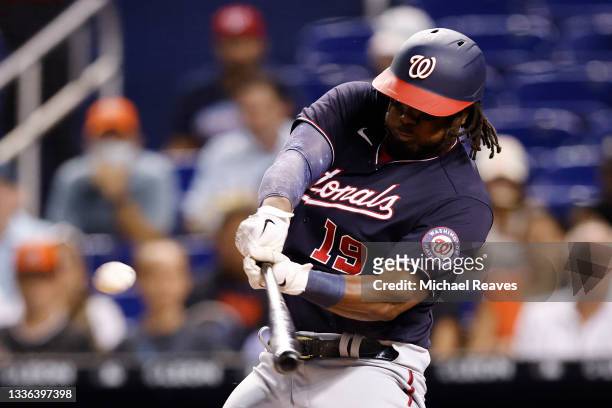 Josh Bell of the Washington Nationals hits a two-run home run off Edward Cabrera of the Miami Marlins during the seventh inning at loanDepot park on...
