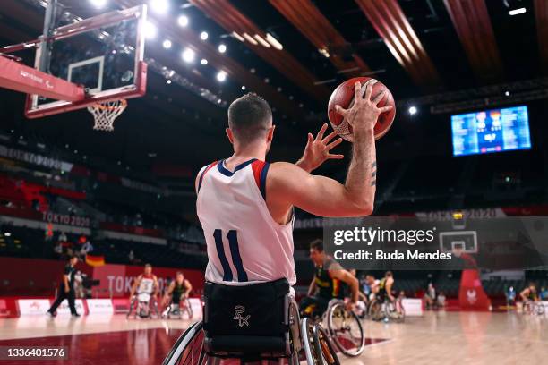 Steve Serio of Team USA inbounds the ball during the Men's Preliminary Round Group B match between Team United States and Team Germany on day 2 of...