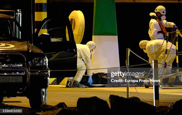 Mortuary workers carry the bodies of the three migrant women who were shipwrecked at sea off the coast of Lanzarote, in Puerto del Rosario of...