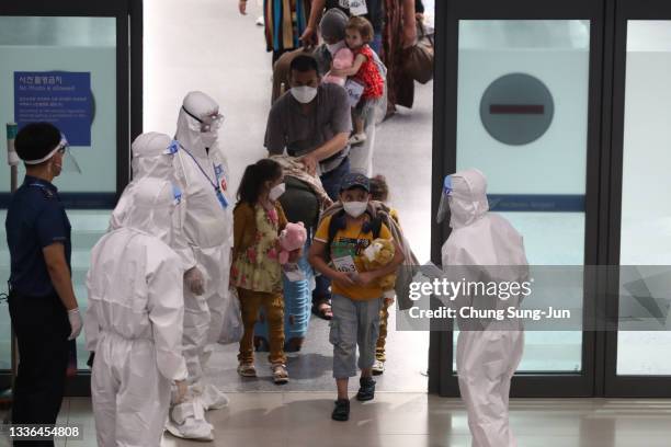Evacuees from Afghanistan arrive at Incheon International Airport on August 26, 2021 in Incheon, South Korea. A total of 378 Afghans arrived in South...