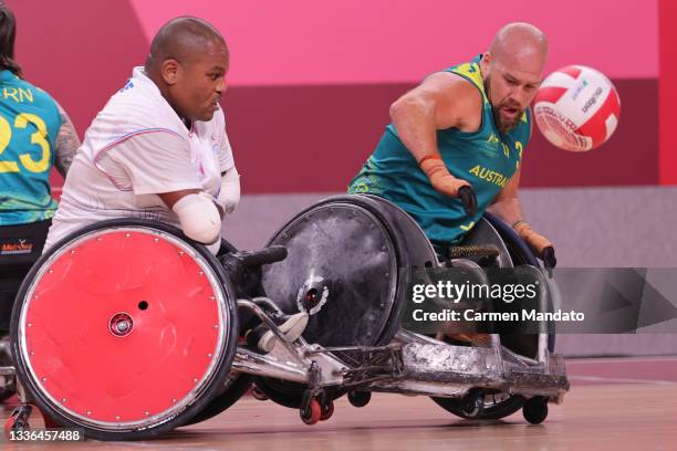 Ryley Batt of Team Australia battles Adrien Chalmin of Team France for ball control during the Wheelchair Rugby Pool Phase Group A game on day 2 of...