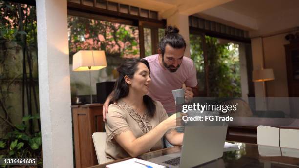 couple together doing home finances at home - demonstration against the marriage for all bill stock pictures, royalty-free photos & images