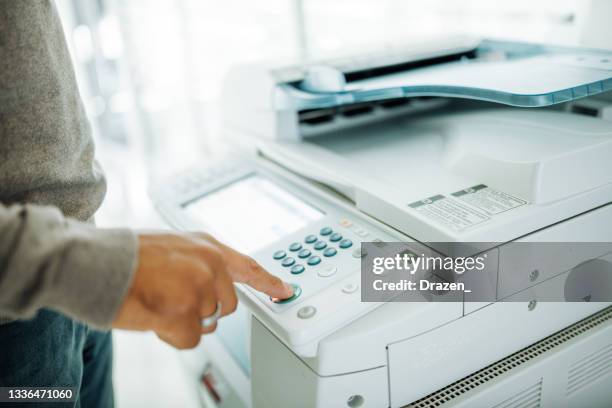 african american businessman in office using copier - copying bildbanksfoton och bilder