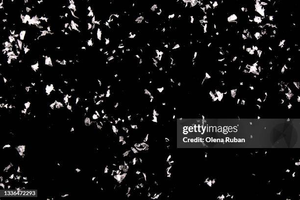 large flakes of snow on a black background - broken ice stock pictures, royalty-free photos & images