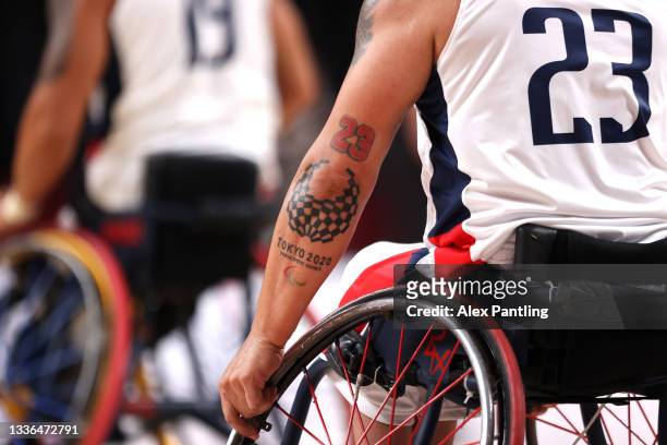Detailed view of a Tokyo 2020 Paralympic logo tattoo onto the arm of Jhoan Vargas of Team Colombia during the Wheelchair Basketball Men's preliminary...
