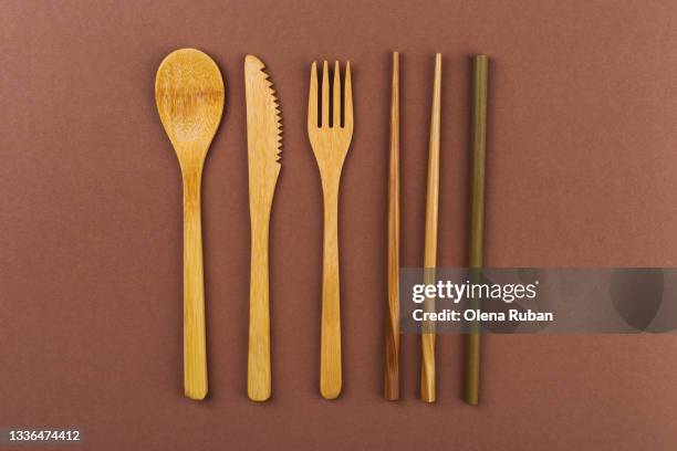 bamboo cutlery on a natural brown background - loofah stock pictures, royalty-free photos & images