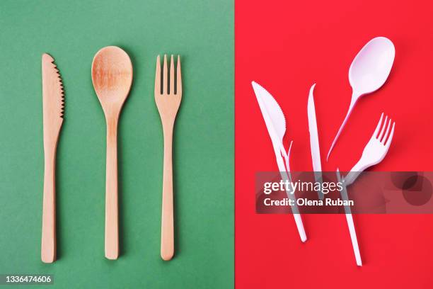 bamboo and broken plastic cutlery on a two-color background - disposable silverware stock pictures, royalty-free photos & images