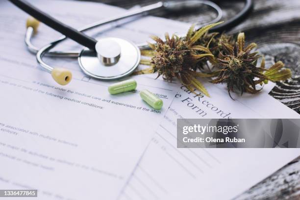 medical marijuana on the doctor table close-up - medical marijuana law stock pictures, royalty-free photos & images