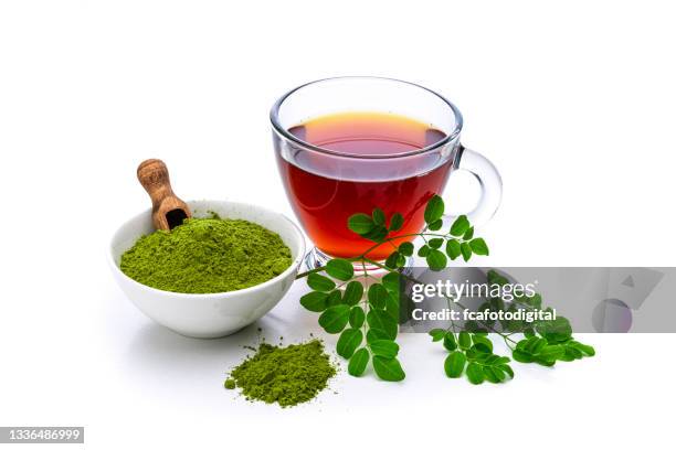 matcha tea cup and matcha powder on white - moringa stock pictures, royalty-free photos & images