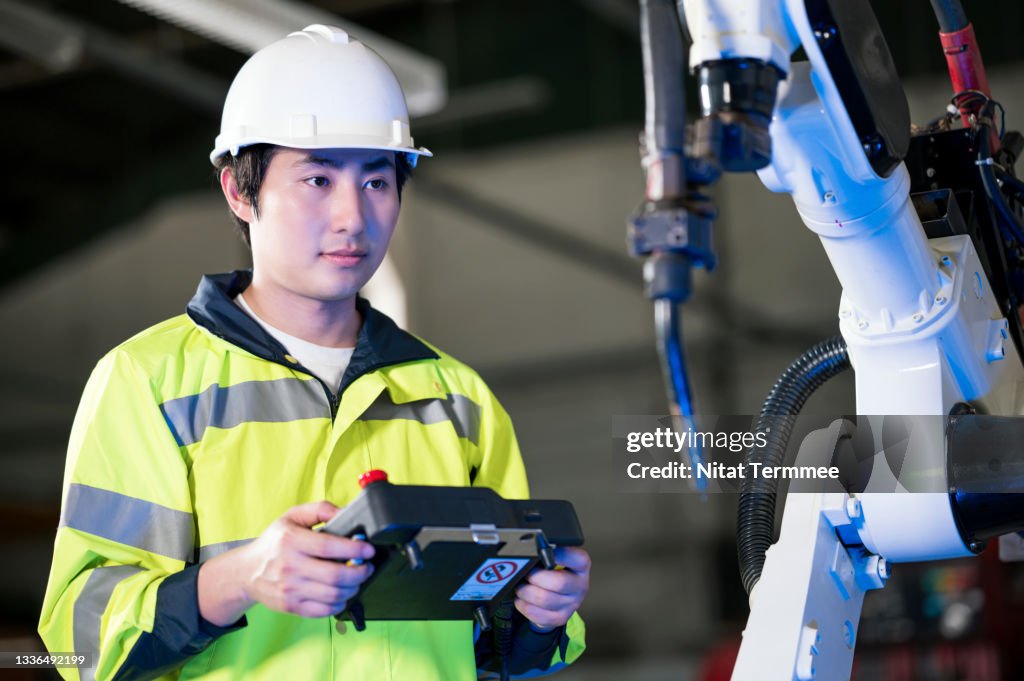 We need to increase productivity. Engineer operating and testing functional industrial robotics welding in an auto parts production line of a factory. Productivity and Quality Improvement. Zero waste in manufacturing concepts.
