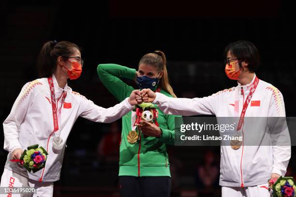 Silver medallist Jing Rong of Team China, Gold medallist Amarilla Veres of Team Hungary and Bronze medallist Jing Bian of Team China pose during the...