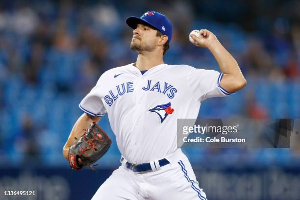 Brad Hand of the Toronto Blue Jays pitches in the ninth inning of their MLB game against the Chicago White Sox at Rogers Centre on August 24, 2021 in...