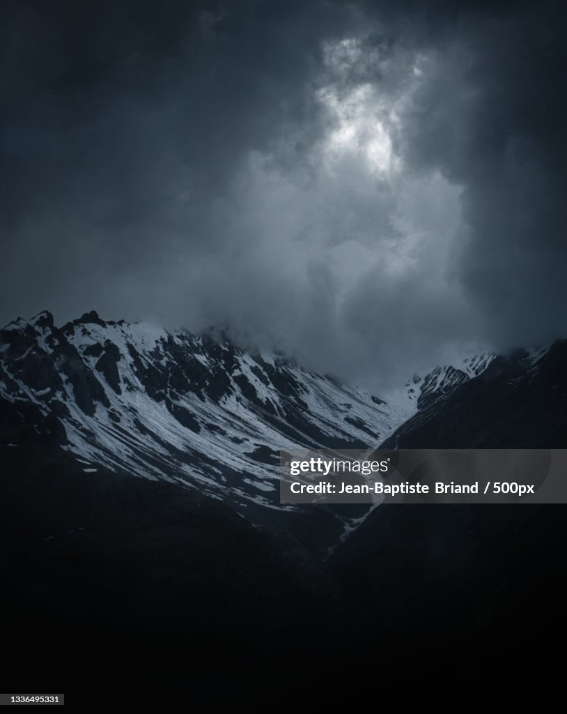 Scenic view of snowcapped mountains against sky at night,Valloire,France