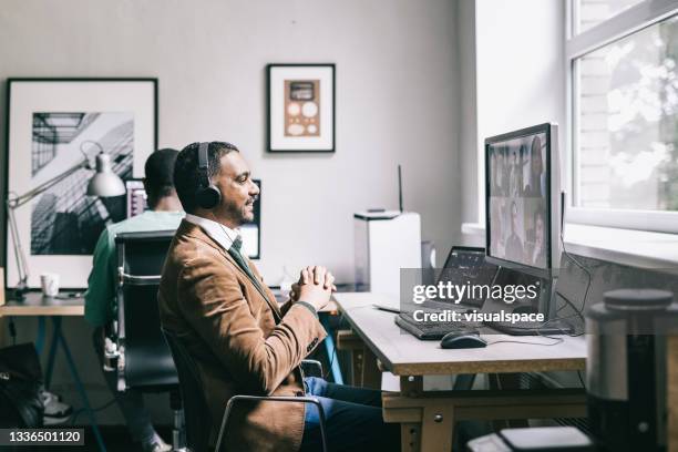 programmer having a team meeting online - estonia technology stock pictures, royalty-free photos & images