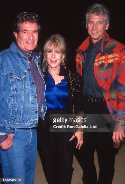 View of, from left, actors Hugh O'Brian, Barbara Eden, and Barry Bostwick as they attend an 'Under Western Stars' screening at Warner Brothers...
