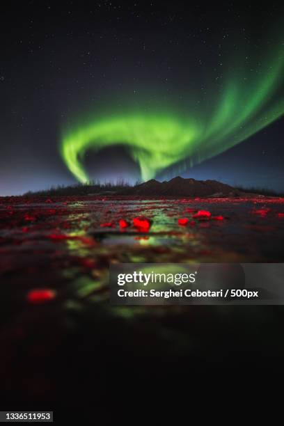 scenic view of aurora borealis at night,fort mcmurray,alberta,canada - fort mcmurray stock pictures, royalty-free photos & images