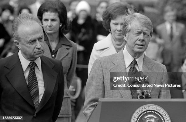 Israeli Prime Minister Yitzhak Rabin listens as US President Jimmy Carter makes remarks outside the White House during the former's State Visit,...