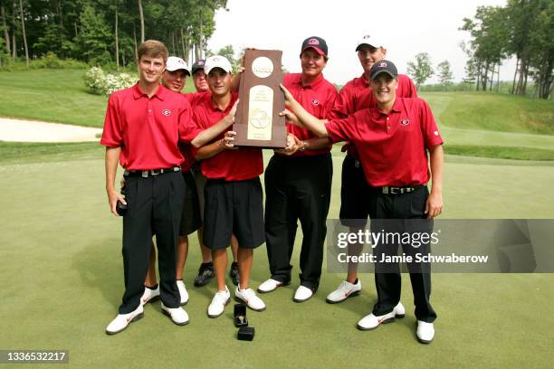 The University of Georgia celebrates their team victory during the Division I Men's Golf Championship held at the Caves Valley Golf Club in...