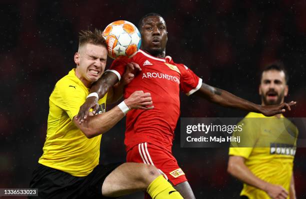 Taneli Hamalainen of Kuopion Palloseura and Sheraldo Becker of 1.FC Union Berlin battle for the ball during the UEFA Conference League Play-Offs Leg...