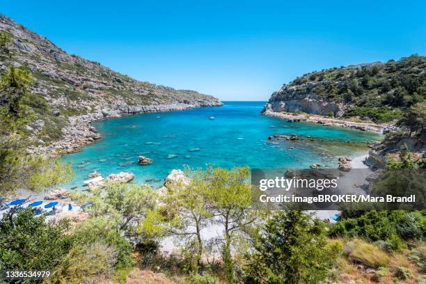 beach and turquoise waters, anthony quinn bay, faliraki, rhodes, dodecanese, greece - anthony quinn bay stock pictures, royalty-free photos & images