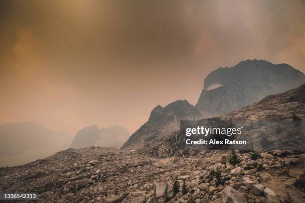 dramatic light on the bugaboo mountains in british columbia - extreme weather stock pictures, royalty-free photos & images